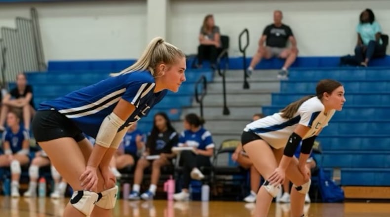 Cincinnati Christian seniors Jenny and Katie Bertram get in the ready position during a regular season game. CONTRIBUTED