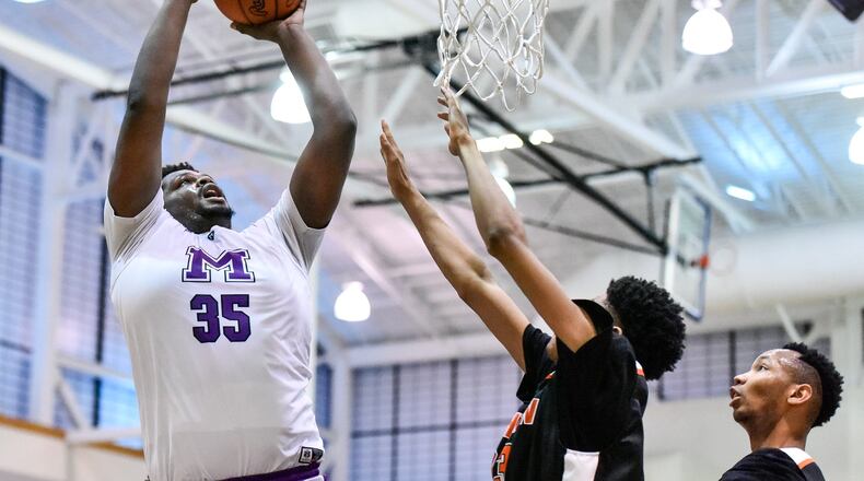 Middletown’s E.J. Williams puts up a shot during a Division I sectional semifinal against Withrow on Feb. 28 at the Hamilton Athletic Center. NICK GRAHAM/STAFF