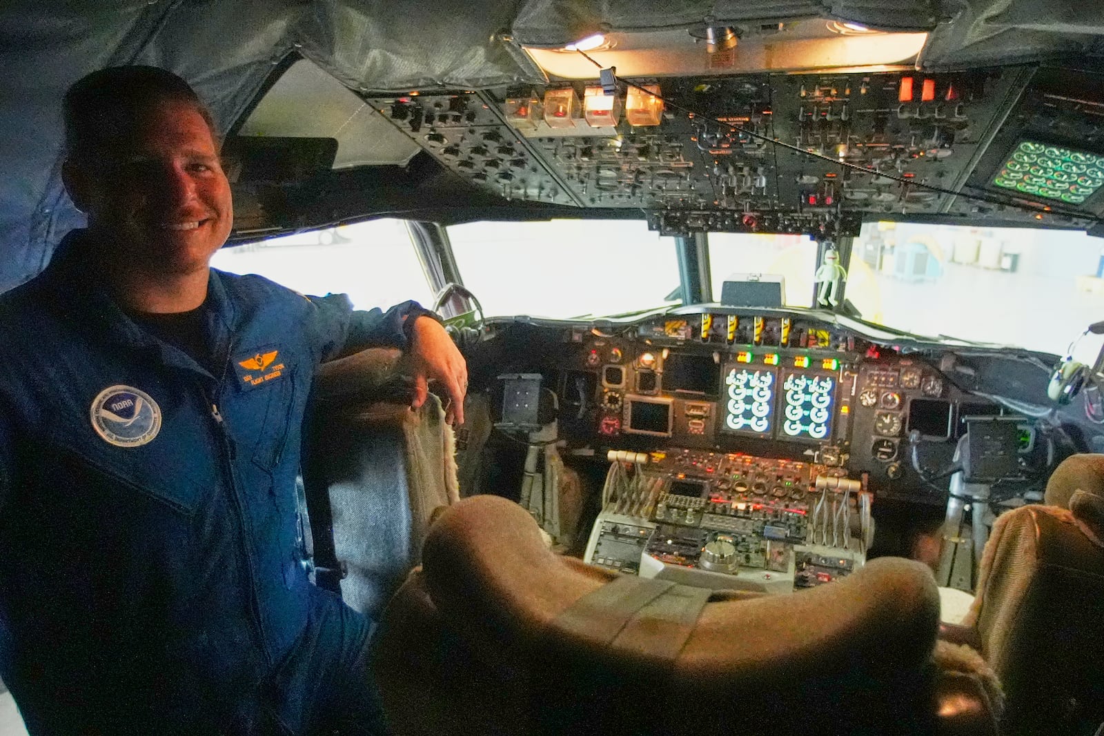 NOAA Flight Engineer Dan Tyson in the cockpit of the Lockheed WP-3D Orion 'Hurricane Hunter' aircraft at the NOAA Aircraft Operations Center Tuesday, May 6, 2025, in Lakeland, Fla. (AP Photo/John Raoux)
