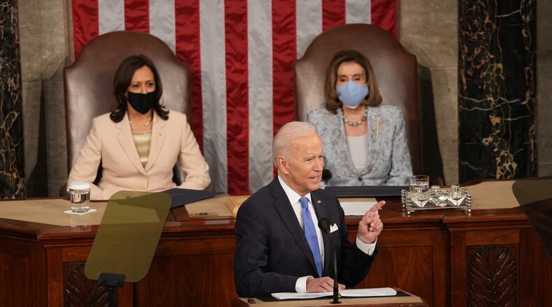 President Joe Biden addresses a joint session of Congress at the Capitol in Washington on Wednesday, April 28, 2021, as Vice President Kamala Harris, left, and Speaker of the House Nancy Pelosi (D-Calif.) look on. (Doug Mills/The New York Times)