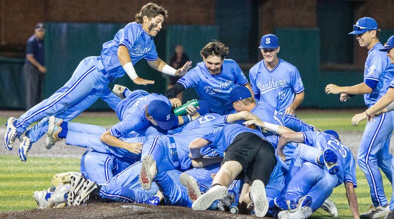 Springboro piles on at the mound after defeating Mason 8-6 in Thursday's Division I regional final at Miami University. Jeff Gilbert/CONTRIBUTED