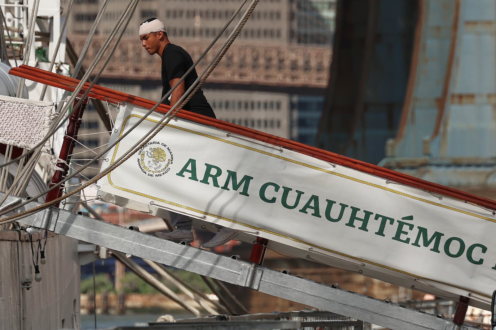 A sailor arrives back at the Cuauhtémoc, Sunday, May 18, 2025 in New York, a masted Mexican Navy training ship that collided with the Brooklyn Bridge the night before. (AP Photo/Yuki Iwamura)