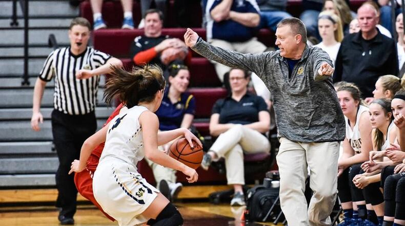 Monroe coach Chad Allen works the sideline as play continues in front of him during a Division II sectional final Feb. 26, 2018, against Franklin at Lebanon. Franklin won 44-39. NICK GRAHAM/STAFF