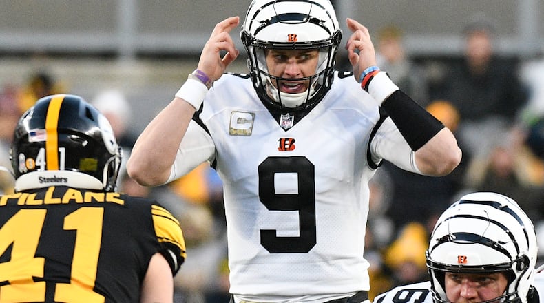 Cincinnati Bengals quarterback Joe Burrow (9) calls signals against the Pittsburgh Steelers during the first half of an NFL football game, Sunday, Nov. 20, 2022, in Pittsburgh. (AP Photo/Don Wright)