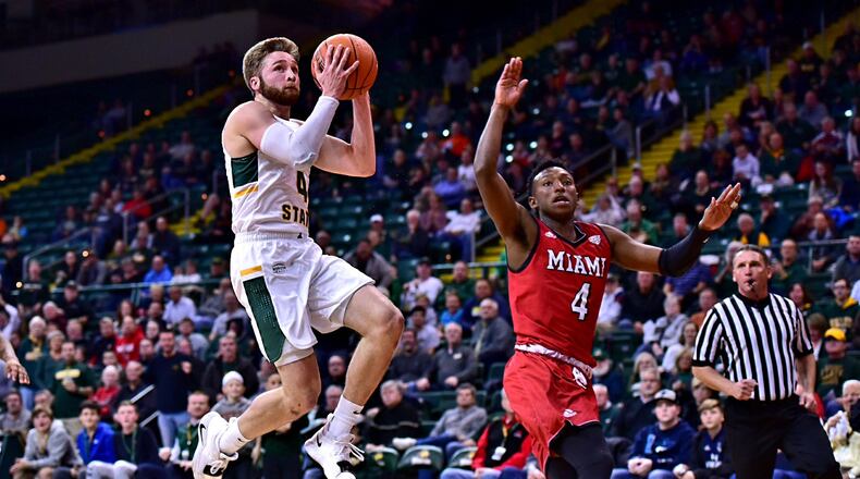 Miami’s Isaiah Coleman-Lands defends Wright State’s Alan Vest during Wednesday night’s game at the Nutter Center. Coleman-Lands hit a buzzer-beating 3-pointer to lift the RedHawks past Wright State, 65-62. CONTRIBUTED PHOTO