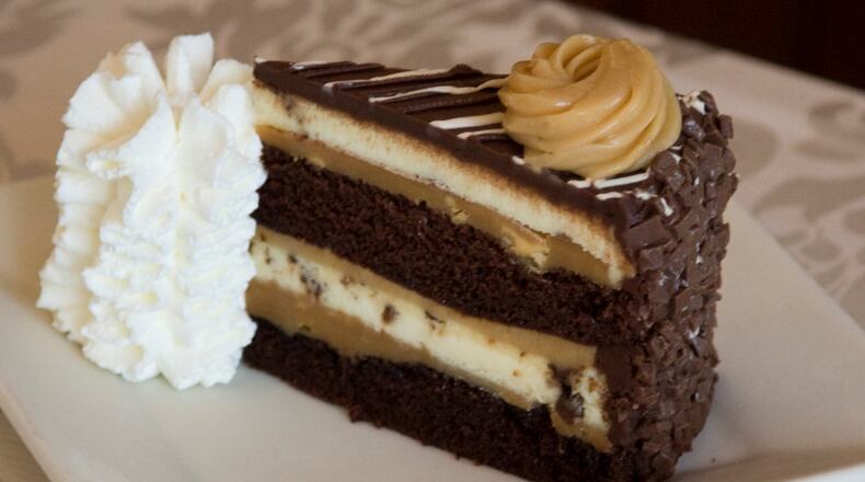 VIRGINIA BEACH, USA - JULY 29: The Cheesecake Factory's newest addition, Reese's Peanut Butter Chocolate Cake Cheesecake, is revealed on National Cheesecake Day at The Cheesecake Factory on July 29, 2010 in Virginia Beach, Virginia. (Photo by Roberto Westbrook/Getty Images for The Cheesecake Factory)