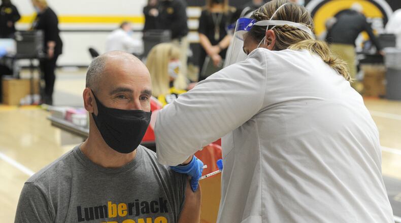 Oakwood schools Superintendent Kyle Ramey, receives his first dose of COVID-19 vaccine at Centerville High School, Wednesday, Feb. 3, 2021.