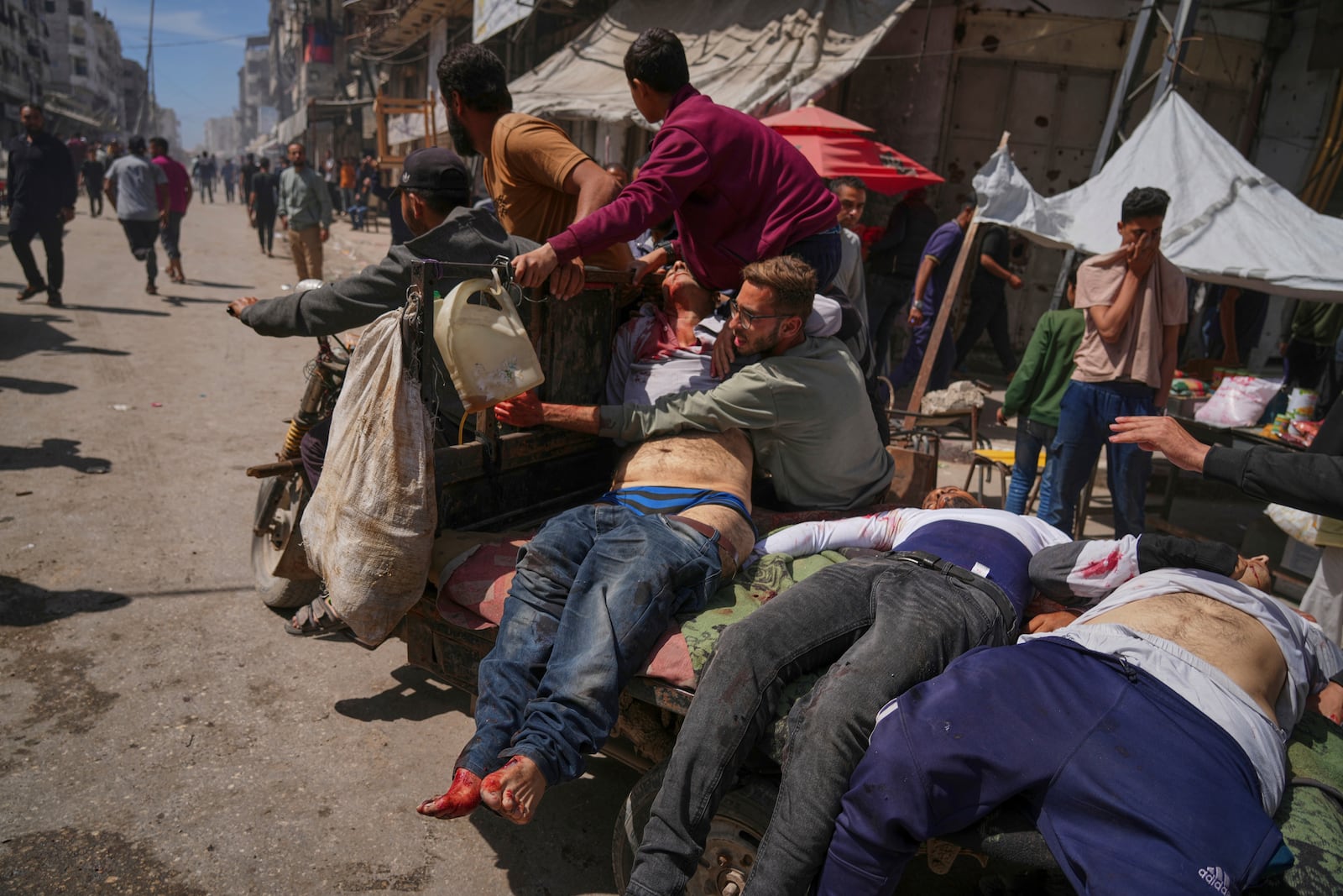 Bodies of some of the victims of an Israeli army strike on a restaurant, which killed at least 29 people, are transported from the scene to a hospital in Gaza City, Wednesday, May 7, 2025.(AP Photo/Jehad Alshrafi)