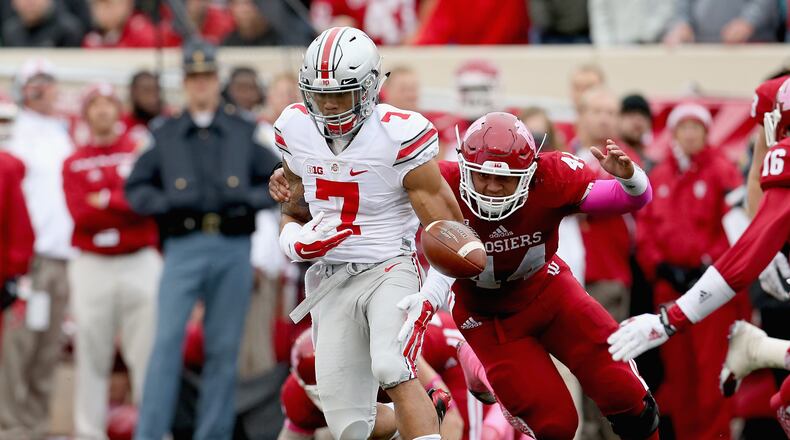 BLOOMINGTON, IN - OCTOBER 03: Jalin Marshall #7 of the Ohio State Buckeyes fumbles the ball while defended by Marcus Oliver #44 of the Indiana Hoosiers at Memorial Stadium on October 3, 2015 in Bloomington, Indiana. (Photo by Andy Lyons/Getty Images)
