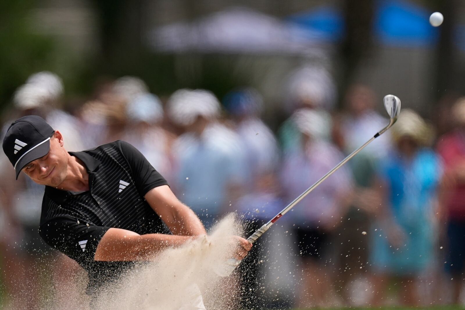 Ludvig Aberg, of Sweden, hits from a bunker on the 16th hole during the second round of the RBC Heritage golf tournament, Friday, April 18, 2025, in Hilton Head Island, S.C. (AP Photo/Mike Stewart)