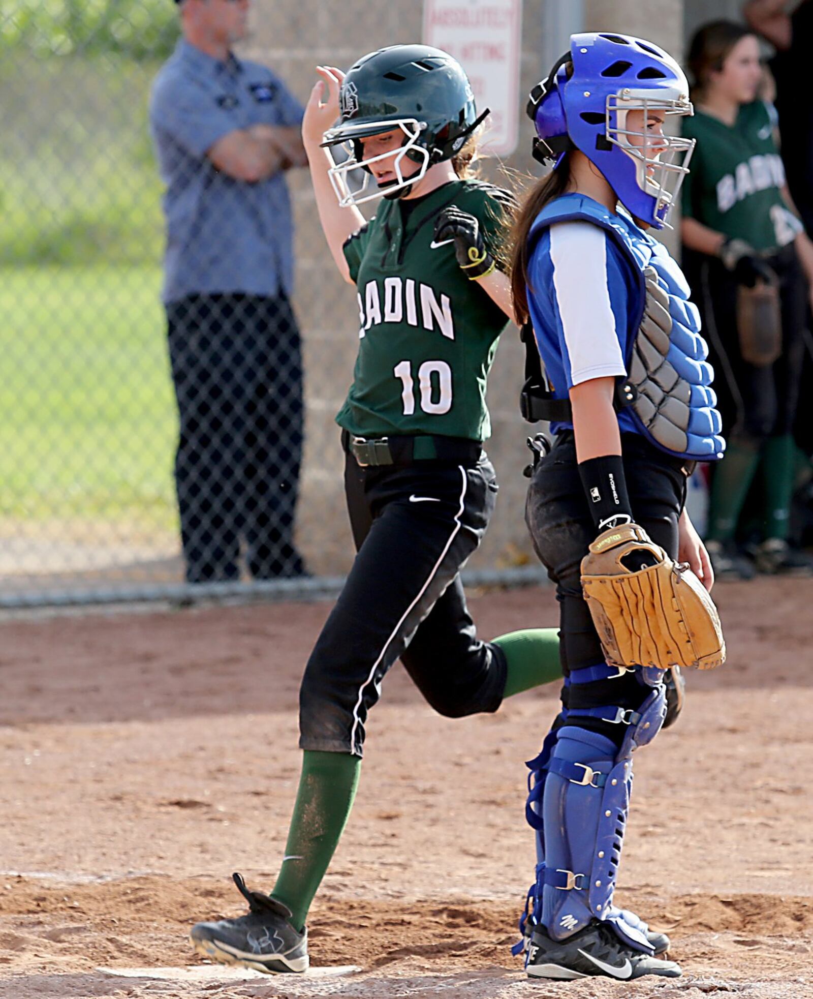Badin’s Gabby Hogan crosses the plate as Clermont Northeastern catcher Kayla Nichols waits for the throw Monday during a Division III district final at Kings. CONTRIBUTED PHOTO BY E.L. HUBBARD