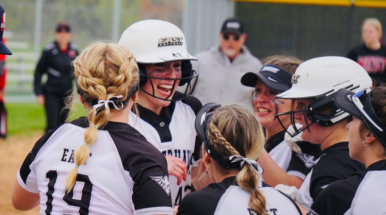 Lakota East's Amber Munoz is swarmed by her teammates after hitting a walk-off home run against Lakota West earlier this season Chris Vogt/CONTRIBUTED