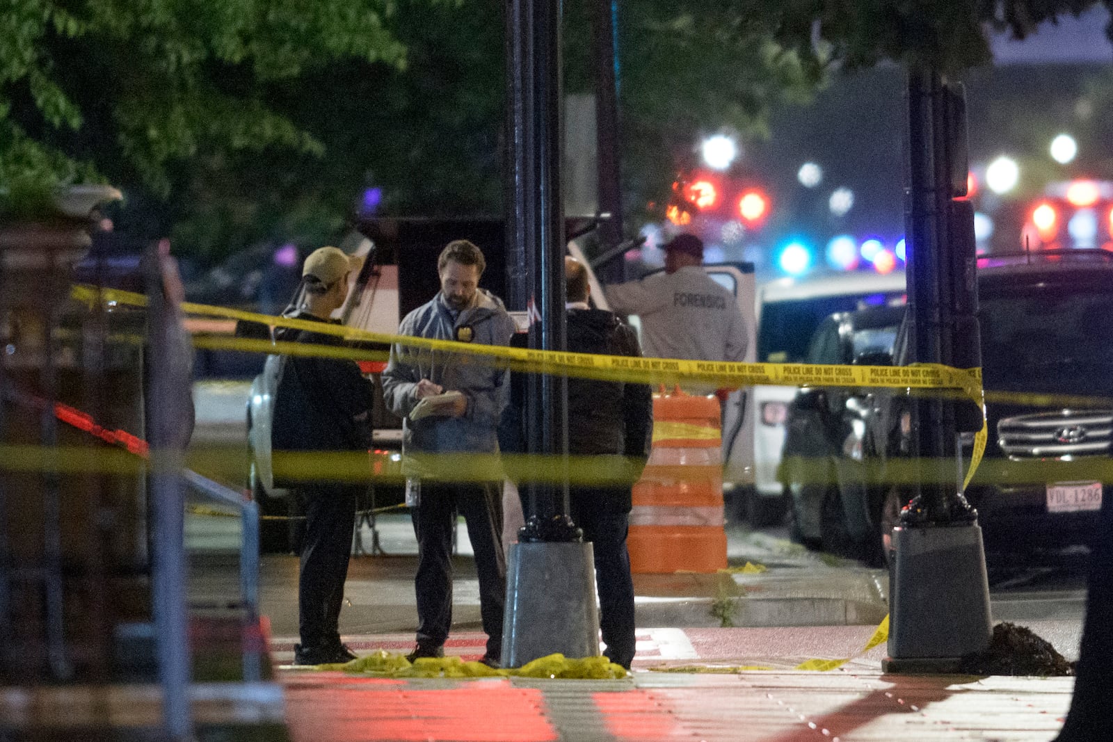 Law enforcement work the scene after two staff members of the Israeli Embassy in Washington were shot and killed outside the Capital Jewish Museum, Thursday, May 22, 2025, in Washington. (AP Photo/Rod Lamkey, Jr.)