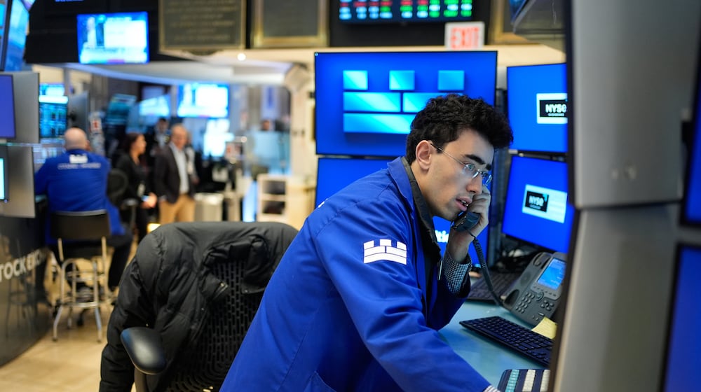 Alexander Weitzman works on the floor at the New York Stock Exchange in New York, Wednesday, March 25, 2026. (AP Photo/Seth Wenig)