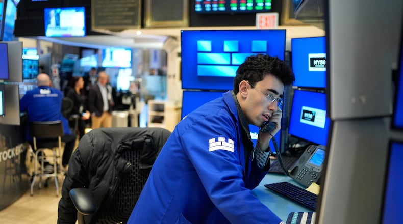 Alexander Weitzman works on the floor at the New York Stock Exchange in New York, Wednesday, March 25, 2026. (AP Photo/Seth Wenig)