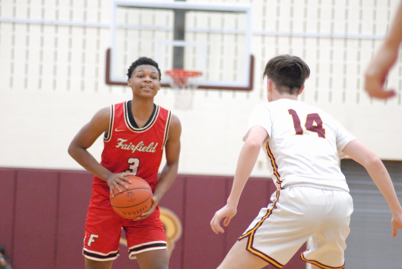 Fairfield sophomore Kameron Sanders is guarded by Ross senior Luke Fulmer during their game on Dec. 30, 2022. Chris Vogt/CONTRIBUTED