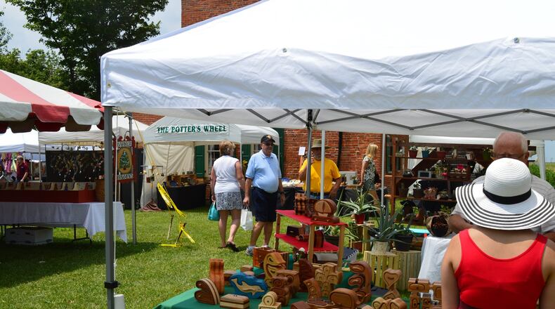 Visitors browse the vendors tents at the Hueston Woods Arts & Crafts Fair in 2016. CONTRIBUTED/BOB RATTERMAN