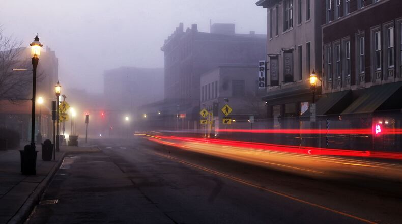 Vehicles drive along a foggy Central Avenue Wednesday morning, March 26, 2025 in Middletown. NICK GRAHAM/STAFF
