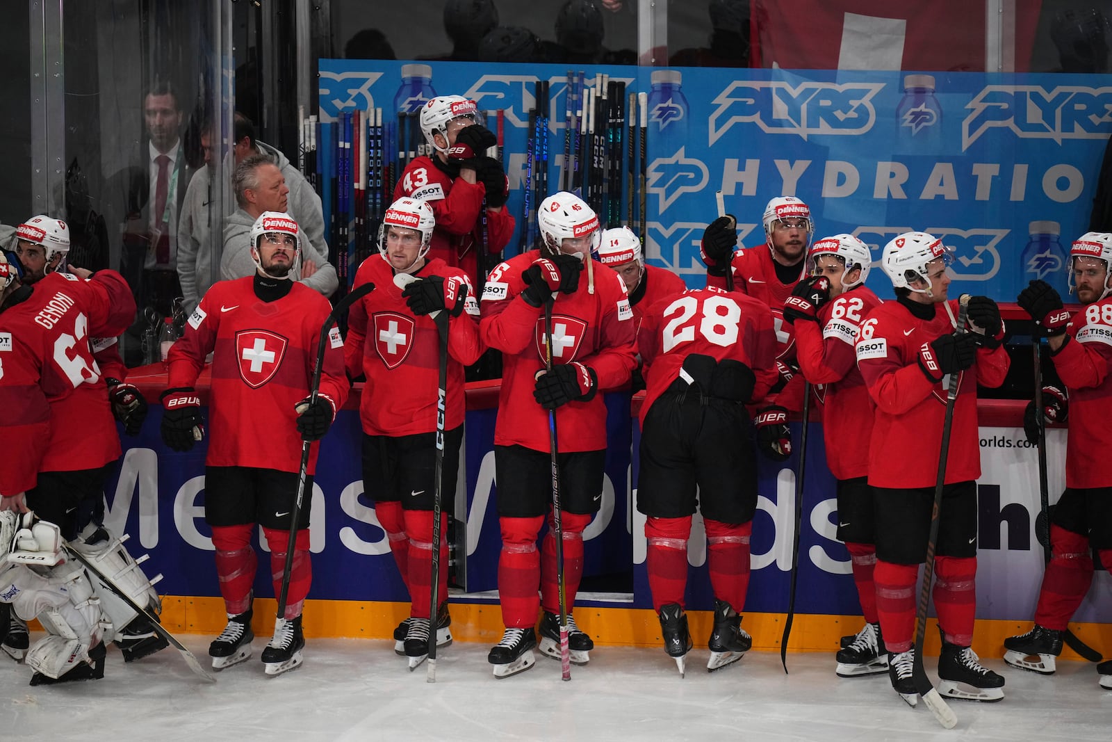 Swiss players stand dejected after the final match between United States and Switzerland at the ice hockey world championships in Stockholm, Sweden, Sunday, May 25, 2025. (AP Photo/Petr David Josek)