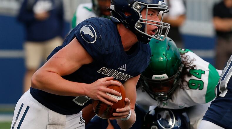 Fairmont quarterback Brock Baker runs with the ball during Friday's game against Northmont. BILL LACKEY/STAFF