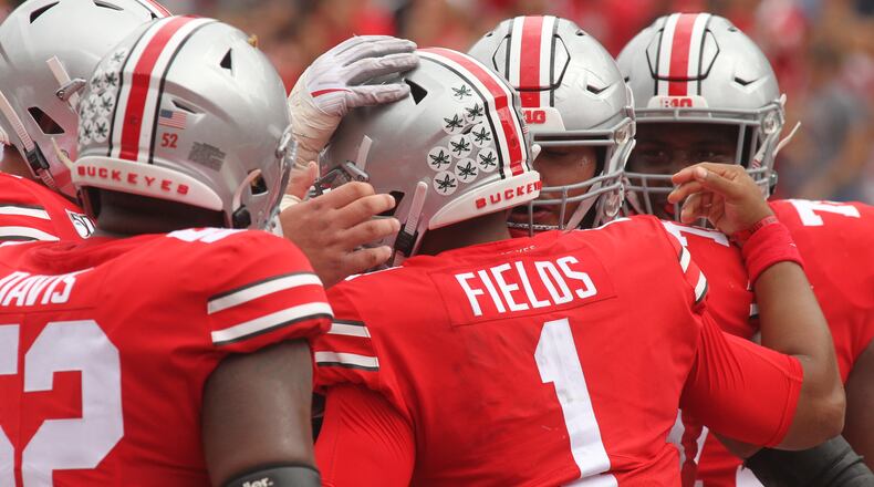 Justin Fields and the Buckeyes celebrate in the first half of their game against Cincinnati on Saturday. (Photo: David Jablonski, CMGO)