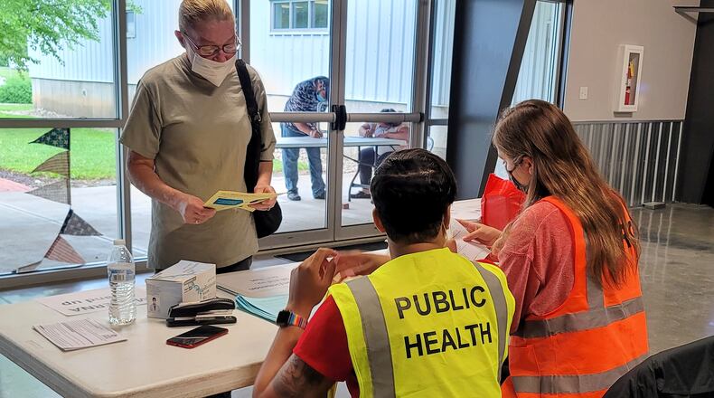 Emily King registers for her COVID-19 vaccine last week at the Butler County Fairgrounds. The Butler County Health Department, with help from other agencies, continues its vaccination clinics with Walk-in Wednesdays at the Butler County Fairgrounds in Hamilton. The clinic runs from 9 a.m. until noon on Wednesdays. NICK GRAHAM / STAFF
