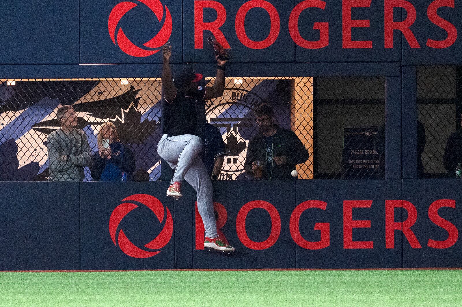 Cleveland Guardians right fielder Jhonkensy Noel (43) misplays a ball off the wall hit by Toronto Blue Jays right fielder George Springer for a double during the first inning of a baseball game in Toronto, Saturday, May 3, 2025. (Jon Blacker/The Canadian Press via AP)