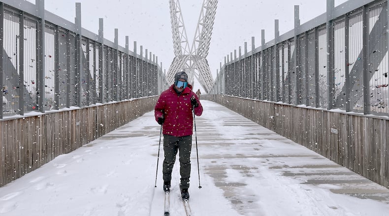 Jacob Coleman skis across SkyDance Bridge over Interstate 40 during a snowstorm in Oklahoma City on Saturday, Jan. 24, 2026. (AP Photo/Thomas Peipert)