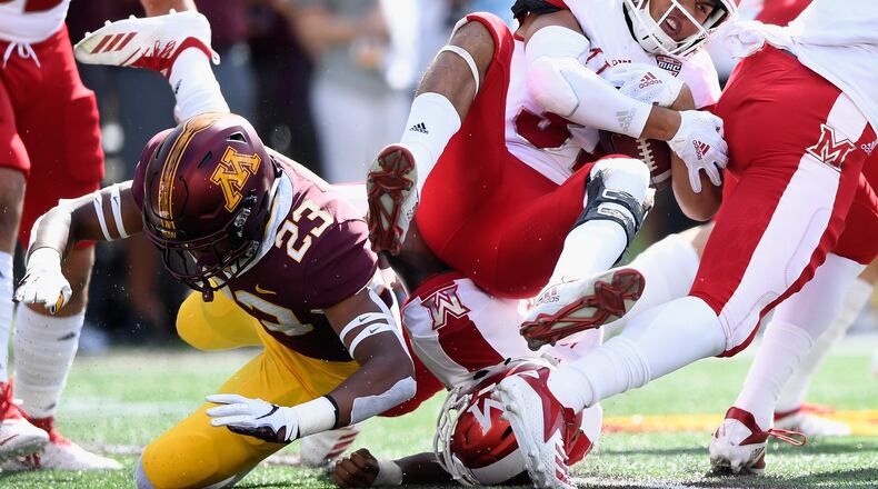 Jordan Howden #23 of the Minnesota Golden Gophers tackles Maurice Thomas #31 of the Miami RedHawks on the opening kickoff return of the game on September 15, 2018 at TCF Bank Stadium in Minneapolis, Minnesota. (Photo by Hannah Foslien/Getty Images)
