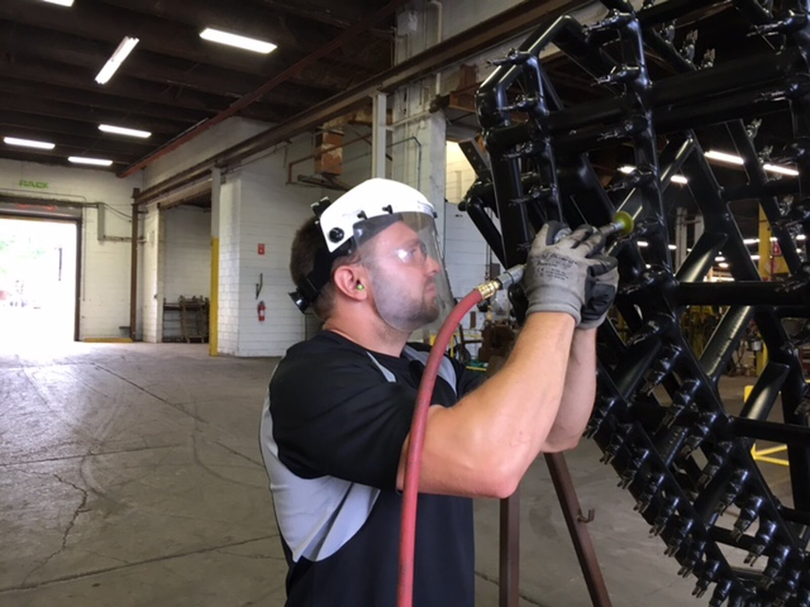 David Croxdale, who works in shipping at Rack Processing Co. Inc. in Moraine. Manufacturers are trying to spread the word that their field offers promising career for people who have the right skills and mindset. THOMAS GNAU/STAFF