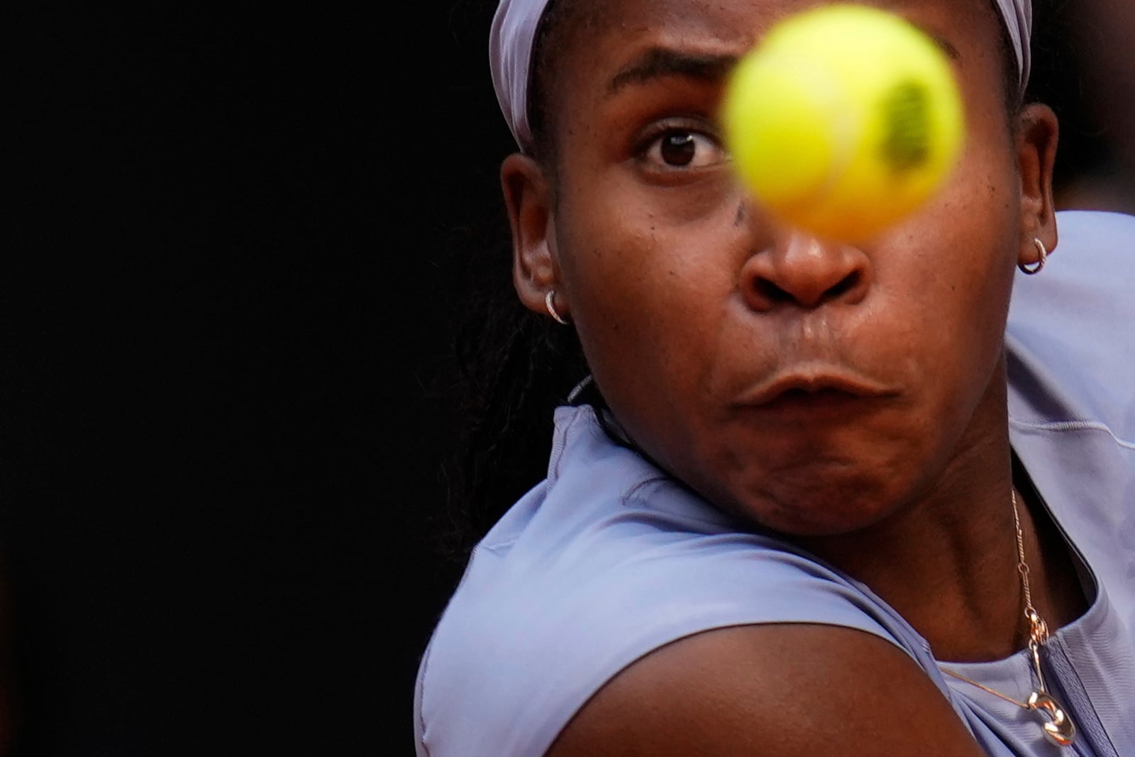 United States' Coco Gauff eyes the ball as she plays Mirra Andreeva of Russia at the Madrid Open quarter-final tennis match in Madrid, Spain, Wednesday, April 30, 2025. (AP Photo/Manu Fernandez)