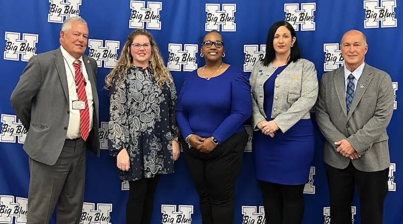 The governing board leader of Hamilton Schools recently graduated with a Miami University degree she sought in the wake of the unsolved homicide of her brother.
The Rev. Shaquila Mathews (center with fellow board members), widely known locally as “Pastor Shaq” has earned an associate degree in Criminal Justice from Miami, according to university officials. (Provided)