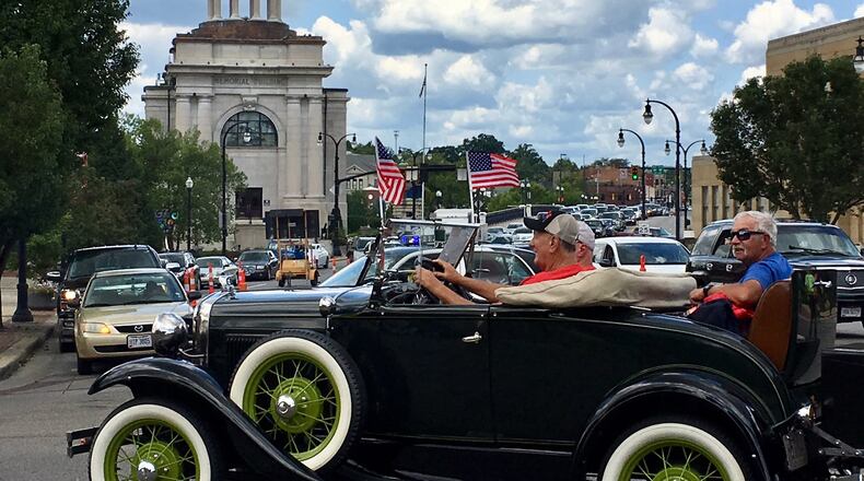 Saturday saw downtown Hamilton magically transformed into a glittering auto museum that moved. The 64th annual Antique & Classic Car Parade Hamilton & Fairfield drew thousands along the parade route between the two Butler County cities. Cars, trucks from all eras were staged along High Street in Hamilton and judges picked the winners in dozens of categories.