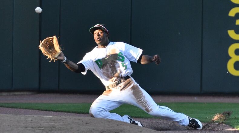 Taylor Trammell catches a foul ball near the Dayton bullpen on the left field line during the third inning of a game against South Bend on Saturday night at Fifth Third Field. Contributed Photo by Bryant Billing