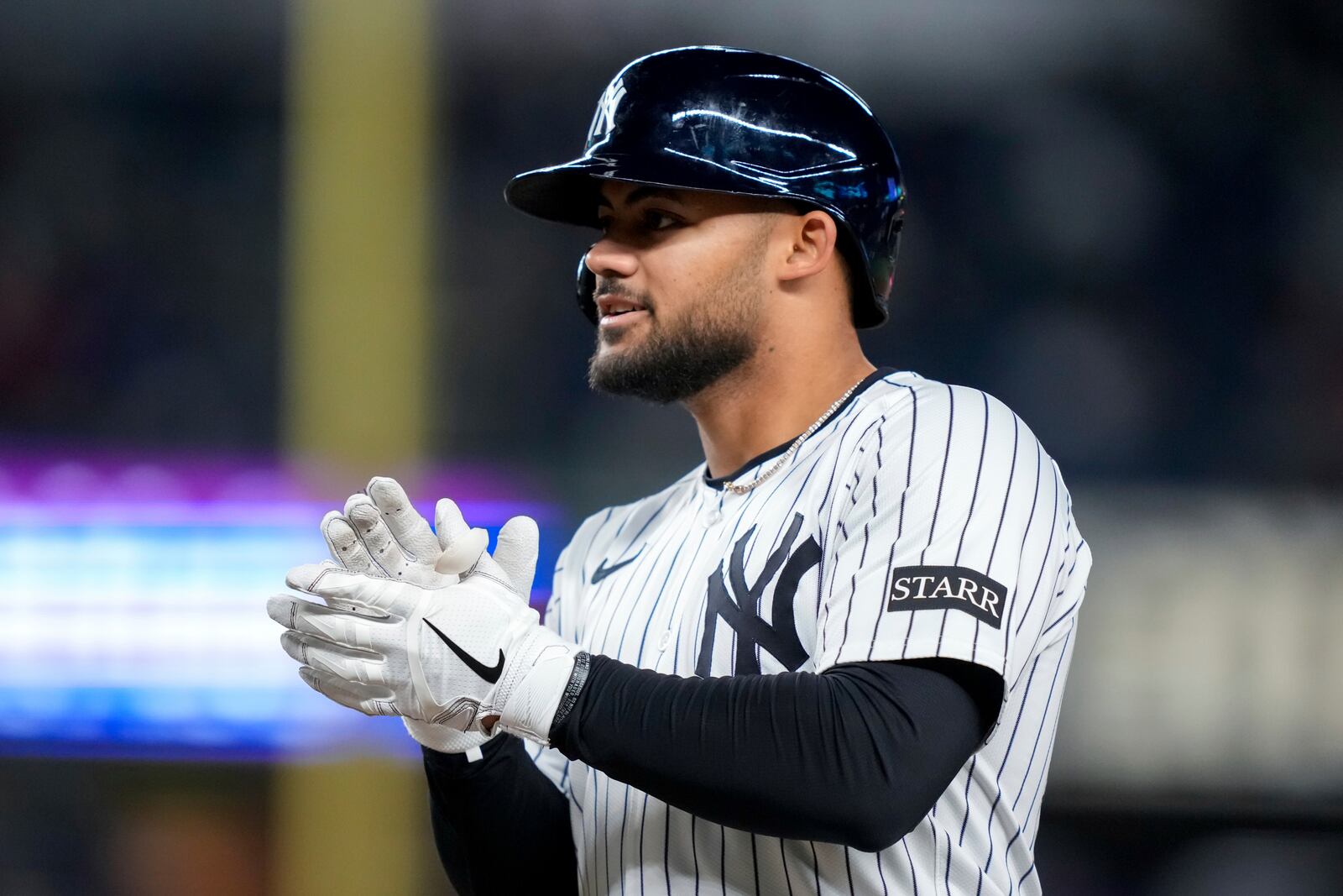 New York Yankees' Jasson Domínguez reacts after singling on a line drive during the fourth inning of a baseball game against the Arizona Diamondbacks, Tuesday, April 1, 2025, in New York. (AP Photo/Julia Demaree Nikhinson)