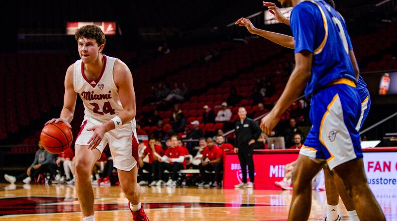 Miami's Jackson Kotecki looks to pass the ball against Spalding University at Millett Hall on Tuesday, Nov. 28, 2023. Ellison Neumann/Miami Athletics photo