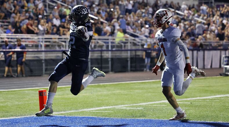 Edgewood's Braden Sullivan crosses the goal line ahead as Talawanda's Ryan Wright pursues during a game at Kumler Field on Oct. 8, 2021. Nick Graham/STAFF