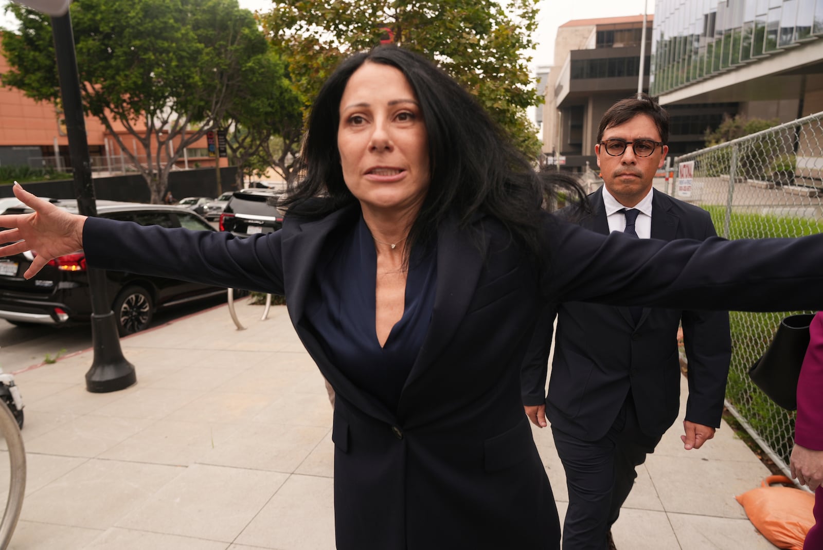 Dr. Salvador Plasencia, right, walks behind his Attorney Debra S. White as he leaves federal court on Wednesday, July 23, 2025 in Los Angeles, after pleading guilty to giving ketamine to Matthew Perry, leading up to the actor's 2023 overdose death. (AP Photo/Damian Dovarganes)