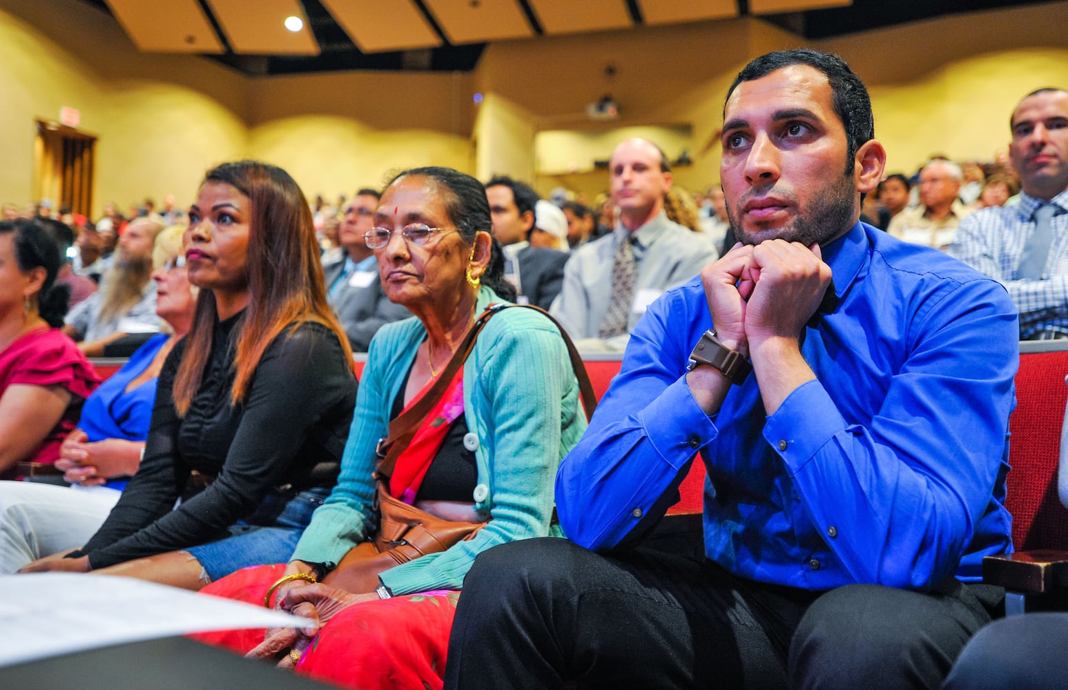 Nearly 100 people become U.S. citizens at naturalization ceremony at Miami Hamilton