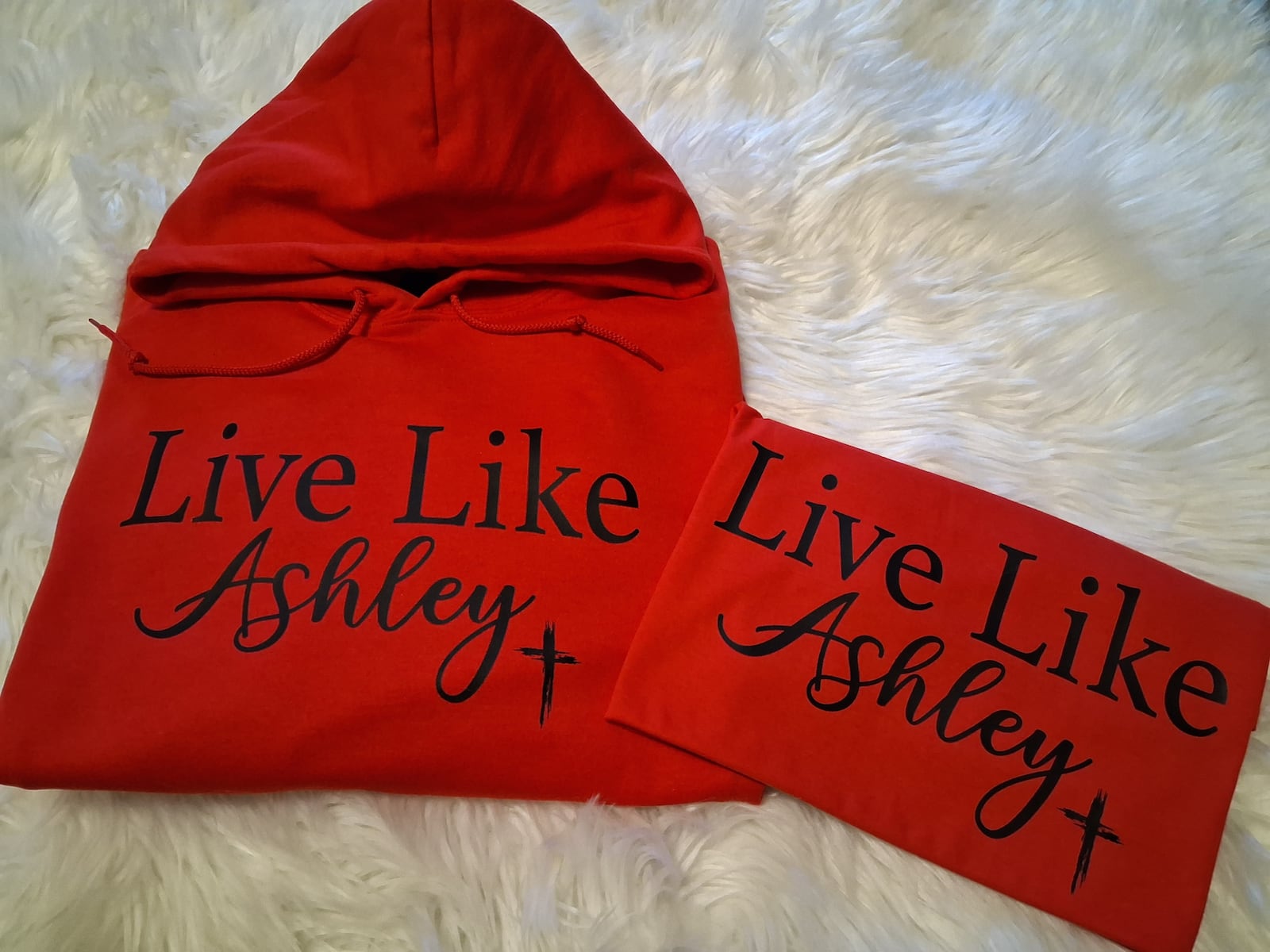 A portion of proceeds from shirts that read "Live Like Ashley" will go toward an online fundraiser to benefit the children of Ashley Flynn, a Tipp City mother, coach and educator killed Feb. 16, 2026, at her home. CONTRIBUTED