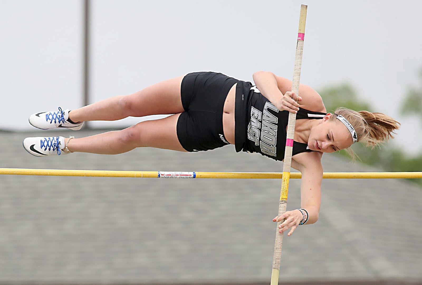 Lindsey Kluesener of Lakota East soars in the pole vault Friday during the Greater Miami Conference track & field meet on Dwire Field at Atrium Stadium in Mason. CONTRIBUTED PHOTO BY E.L. HUBBARD