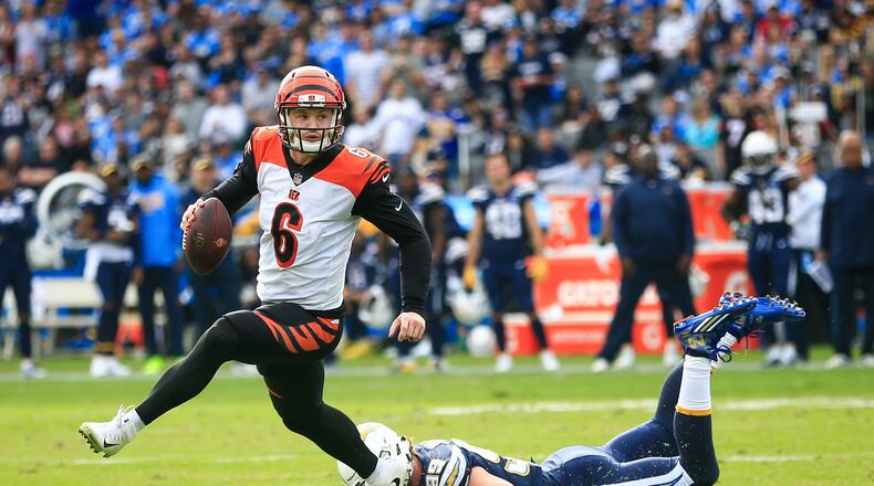 CARSON, CA - DECEMBER 09: Quarterback Jeff Driskel #6 of the Cincinnati Bengals runs a play in front of defensive end Joey Bosa #99 of the Los Angeles Chargers in the second quarter at StubHub Center on December 9, 2018 in Carson, California. (Photo by Sean M. Haffey/Getty Images)