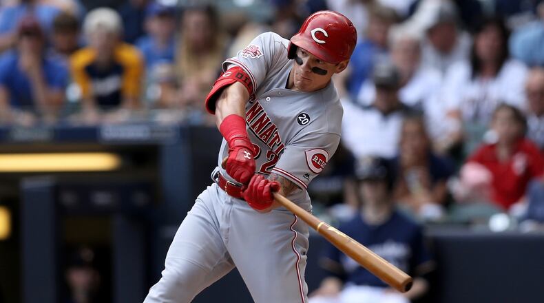 MILWAUKEE, WISCONSIN - JUNE 22: Derek Dietrich #22 of the Cincinnati Reds hits a triple in the first inning against the Milwaukee Brewers at Miller Park on June 22, 2019 in Milwaukee, Wisconsin. (Photo by Dylan Buell/Getty Images)