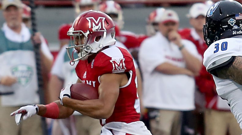 Miami University’s Maurice Thomas carries the ball against Eastern Illinois during their game at Yager Stadium in Oxford on Sept. 10, 2016. CONTRIBUTED PHOTO BY E.L. HUBBARD