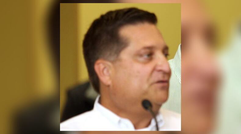 John Cacaro is pictured in 2011 during the ribbon cutting of his West Chester Twp.-based business Employers Choice Plus. Cacaro, 58, pleaded guilty June 5 in United States District Court in Cincinnati to wire fraud and money laundering. STAFF FILE PHOTO