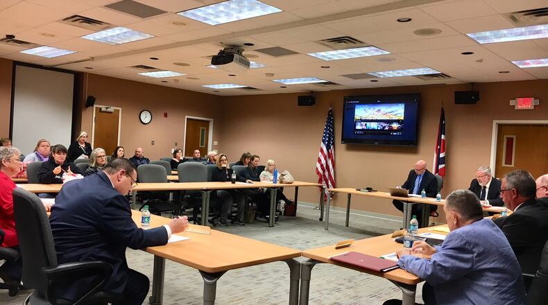 Hamilton s school board heard Tuesday evening that the schools may be getting more armed guards and upgraded security devices installed. MICHAEL D. CLARK / STAFF