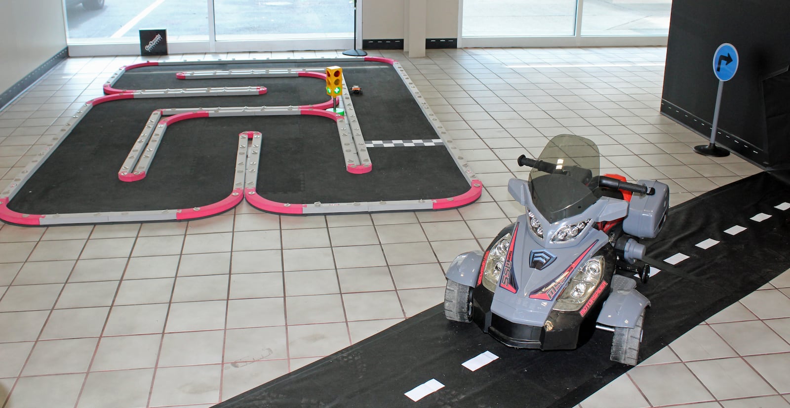 Used car lot Pagotopia & Company has a race car set up in its lobby to entertain children while their parents conduct business. SUE KIESEWETTER/CONTRIBUTED