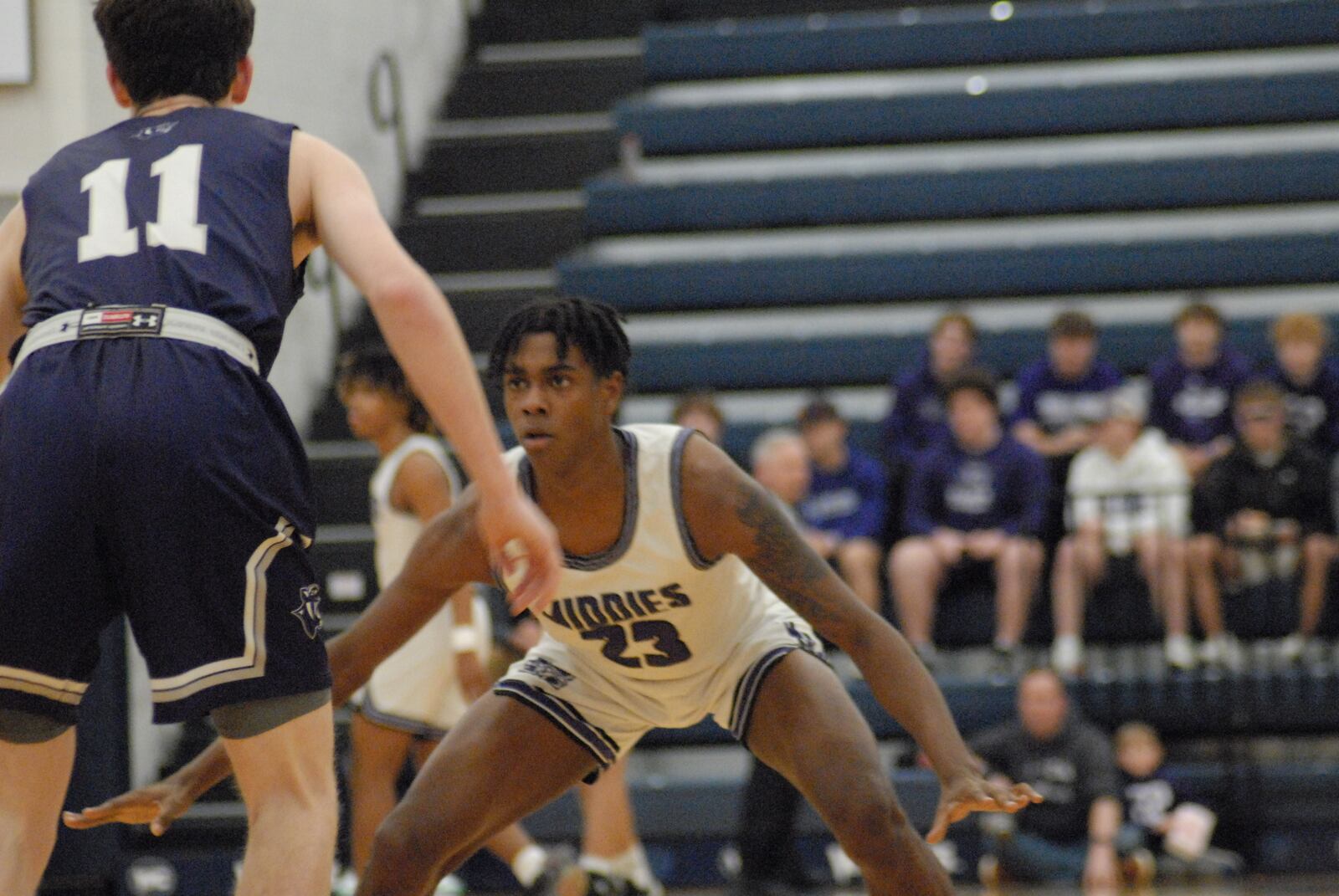 Middletown senior Izaiah Day (23) supplies the defense on Elder junior Drew Murphy (11) during a Division I sectional contest on Tuesday night at West Clermont. The Panthers beat the Middies 54-36. Chris Vogt/CONTRIBUTED