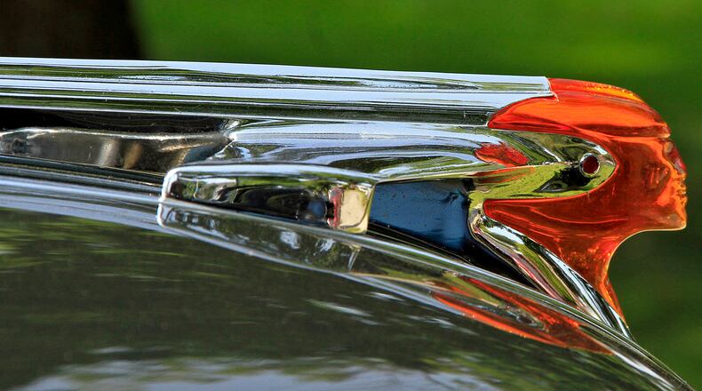The hood ornament on a 1953 Pontiac at a Classics on the Lawn car show in Oakwood. © Photograph by Skip Peterson