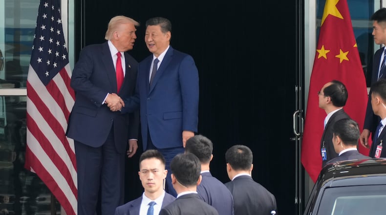 President Donald Trump left, and Chinese President Xi Jinping, shake hands before their U.S.-China summit talk at Gimhae International Airport in Busan, South Korea, Thursday, Oct. 30, 2025. (AP Photo/Mark Schiefelbein)